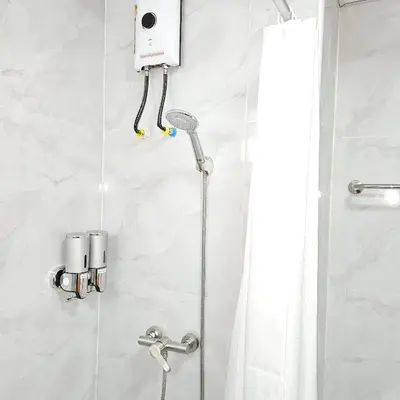 a shower with a shower head in a bathroom at Omni Suites 1Bed #702A in Bangkok