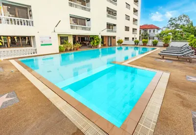 a large swimming pool in front of a building at Omni Suites 1Bed #702A in Bangkok