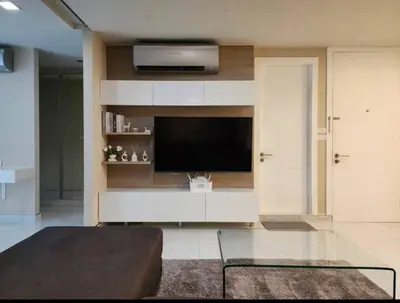 a living room with a flat screen tv and a couch at Condominium - Sukhumvit Soi 5 BTS Nana- Room Size 47m2 in Bangkok