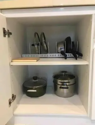 a cabinet with some pots and pans in it at Condominium - Sukhumvit Soi 5 BTS Nana- Room Size 47m2 in Bangkok