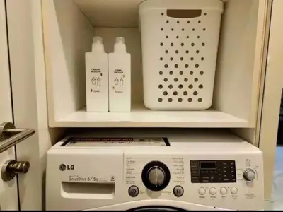 a microwave oven with two bottles on top of it at Condominium - Sukhumvit Soi 5 BTS Nana- Room Size 47m2 in Bangkok
