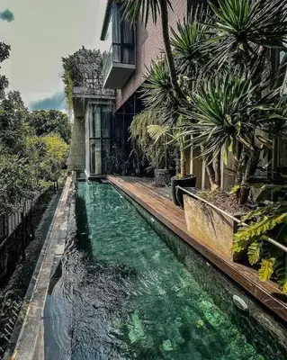 a pool of water in front of a house at Luxury Pool Villa with Jacuzzi & Lift by Thonglor in Bangkok