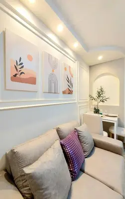a living room with a couch and a table at Joyful room in Ban Song Hong