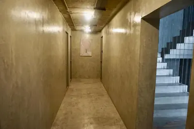 a hallway with a staircase in a building at Triple room at Hash Apartment Silom Soi 3 in Bangkok
