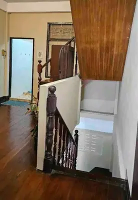 a staircase in a living room with a stair case at DaHouse next to MRT Itsaraphap exit1 in Bangkok Yai