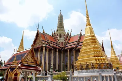 a large building with gold spires on top of it at Lamoon Vivit in Bangkok