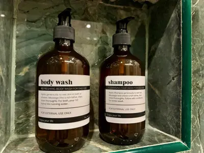 two bottles of whiskey sitting on a shelf at AVALAN PhayaThai airport link in Pratunam