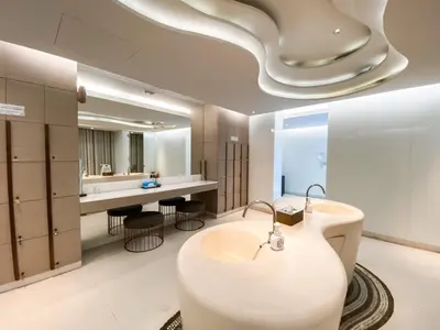 a bathroom with a white tub and a sink at Magnificent Apt 1BR - Ultra Fast WiFi - Ekkamai in Bangkok