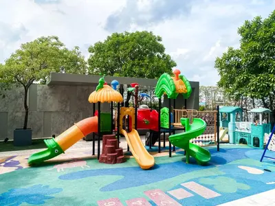 a playground with a slide in a park at Magnificent Apt 1BR - Ultra Fast WiFi - Ekkamai in Bangkok