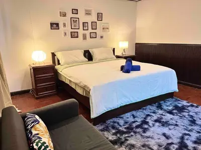 a bedroom with a large bed and a couch at 5BR House BTSNana Nanaplaza City center MBK Center world in Bangkok