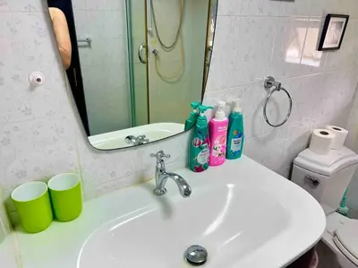 a bathroom with a sink and a mirror at 5BR House BTSNana Nanaplaza City center MBK Center world in Bangkok