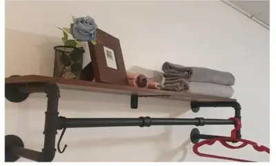 a wooden shelf on a wall with towels at Popular Muang Thong Thani Condo, Building T9, Floor 4, Room 36 in Thung Si Kan