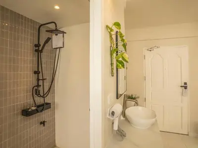 a bathroom with a shower and a toilet in it at Cozy studio room - 2 guests in the heart of Silom - 6B in Bang Rak
