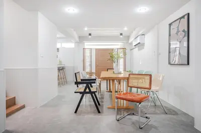 a dining room with a table and chairs at Haus Ekkamai 2 in Khlong Toei