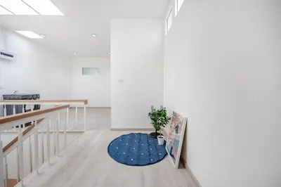 a white room with a potted plant on the floor at Haus Ekkamai 2 in Khlong Toei