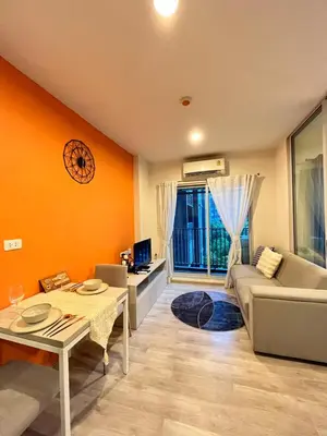 a living room with a couch and a table at Manmanlovehome in Bangkok