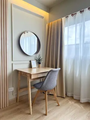 a desk with a chair and a mirror at ห้องพักเมืองทองธานี Happiness sleep C4 in Ban Bang Phang