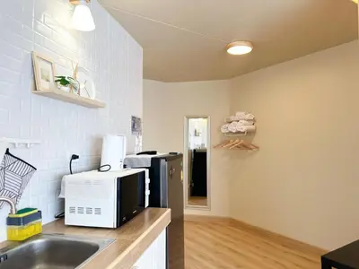 a kitchen with a sink and a microwave at ห้องพักเมืองทองธานี Happiness sleep C4 in Ban Bang Phang