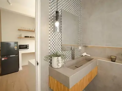 a kitchen with a sink and a refrigerator at 2 Bedroom apartment at Silom with city center view - 5A in Bangkok