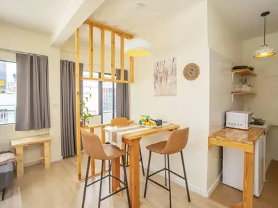 a kitchen with a table and chairs in a room at Cozy studio room for 3 guests at Center-Silom - 5B in Bang Rak