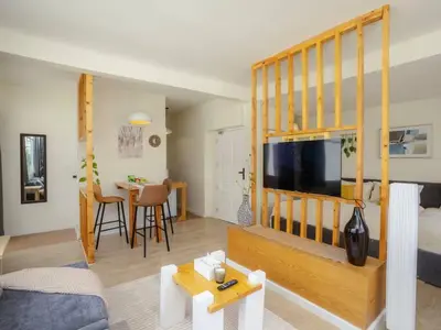 a living room with a large flat screen tv at Cozy studio room for 3 guests at Center-Silom - 5B in Bang Rak