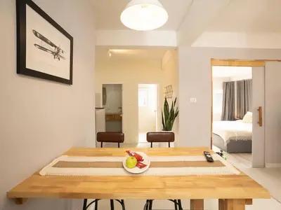 a room with a table with a bowl of fruit on it at 2-Bedroom apartment for 4 guests, Center-Silom - 3A in Bang Rak