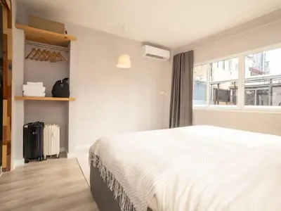 a bedroom with a white bed and a window at 2-Bedroom apartment for 4 guests, Center-Silom - 3A in Bang Rak