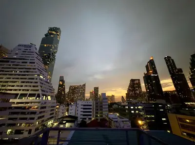 a view of a city skyline at night with tall buildings at Cozy studio for 3 guests in the heart of Silom - 3B in Bang Rak