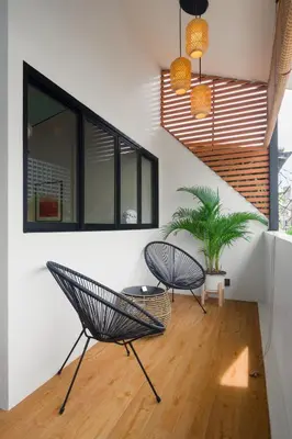 two chairs and a table in a room at Boutique hotel Axis Bangkok in Bangkok
