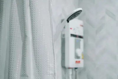 a close up of a machine next to a curtain at My Sukhumvit Villa in Bangkok