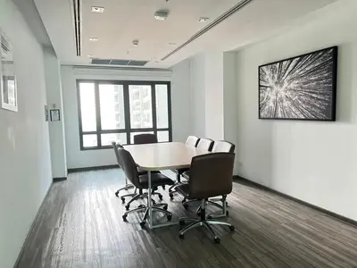 a meeting room with a table and chairs in an office at monthly and Annual condo in Bangkok