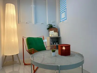 a room with a table and a chair at hana villa in Bangkok