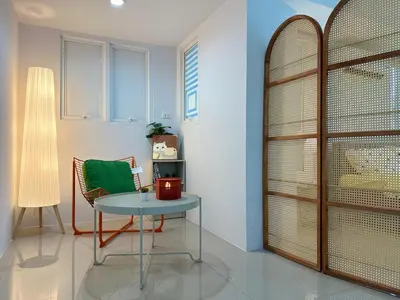 a room with a table and a chair and a window at hana villa in Bangkok