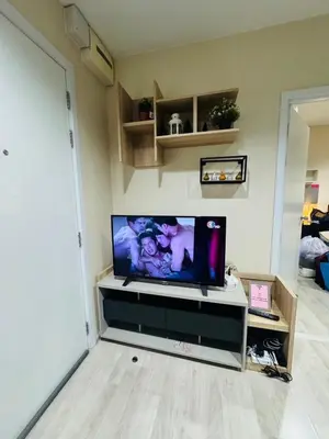a flat screen tv sitting on a stand in a living room at 1 Bedroom Next to IKEA,Central Westgate46 in Ban Bang Krabu
