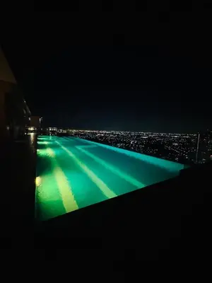 a view of a pool at night at 1 Bedroom Next to IKEA,Central Westgate46 in Ban Bang Krabu