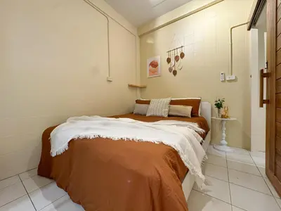 a bedroom with a bed in a room at Nordic Townhouse FIT Group - 800M MRT Huaykwang in Bangkok