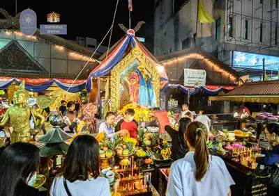 a crowd of people at a market at night at Nordic Townhouse FIT Group - 800M MRT Huaykwang in Bangkok
