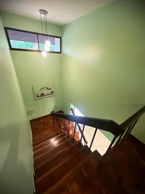 a view of a staircase in a house with a window at Newly-renovated Modern Private Thai Villa with Swimming Pool in Ban Khlong Samrong