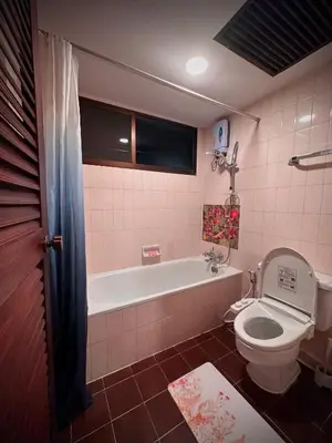 a bathroom with a toilet and a bath tub at Newly-renovated Modern Private Thai Villa with Swimming Pool in Ban Khlong Samrong