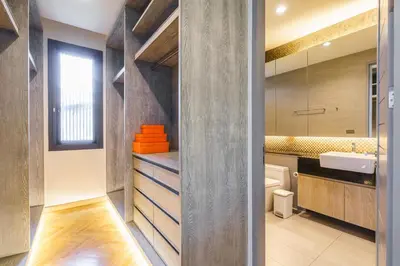 a bathroom with a sink and a mirror at Designer Pool Villa in Ekkamai in Bangkok