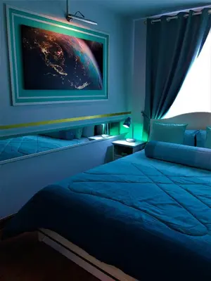 a bedroom with a bed and a painting on the wall at White Turquoise -2 Bedrooms Apartment- in Bangkok