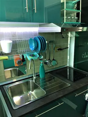 a kitchen counter with a sink and a sink at White Turquoise -2 Bedrooms Apartment- in Bangkok