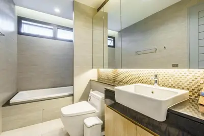 a bathroom with a sink and a toilet at The Designer 49 Villa in Bangkok