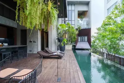 a pool in the middle of a building at The Oasis Tranquil Escape in Bangkok