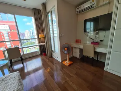 a living room with a desk and a fan at The Address Chidlom 41sqm Studio 650m BTS Chit Lom in Bangkok