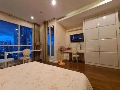 a bedroom with a bed and a desk and a window at The Address Chidlom 41sqm Studio 650m BTS Chit Lom in Bangkok