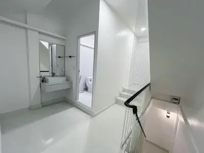 a white bathroom with a sink and a mirror at Fivehouse Silom1 - City heart - Silom -BTS MRT 2min - lumpini park - bnh in Bangkok