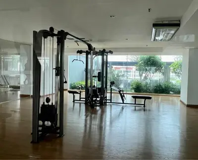 a gym with several treadying machines in a room at Riverside room with best view in heart of BKK in Godown