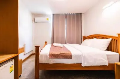 a bedroom with a bed in a room at XX GO INN Khaosan The Grand Palace Bangkok in Bangkok