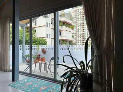a view of a balcony with a table and chairs at Private apartment at Sukhumvit67 Penthouse Unit in Bangkok